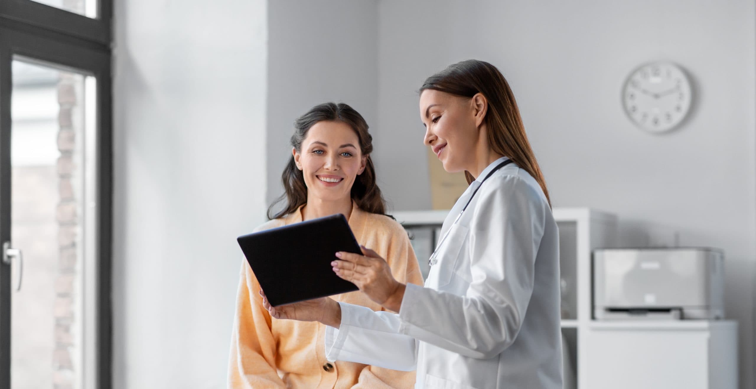 Doctor reviewing treatment plan on tablet