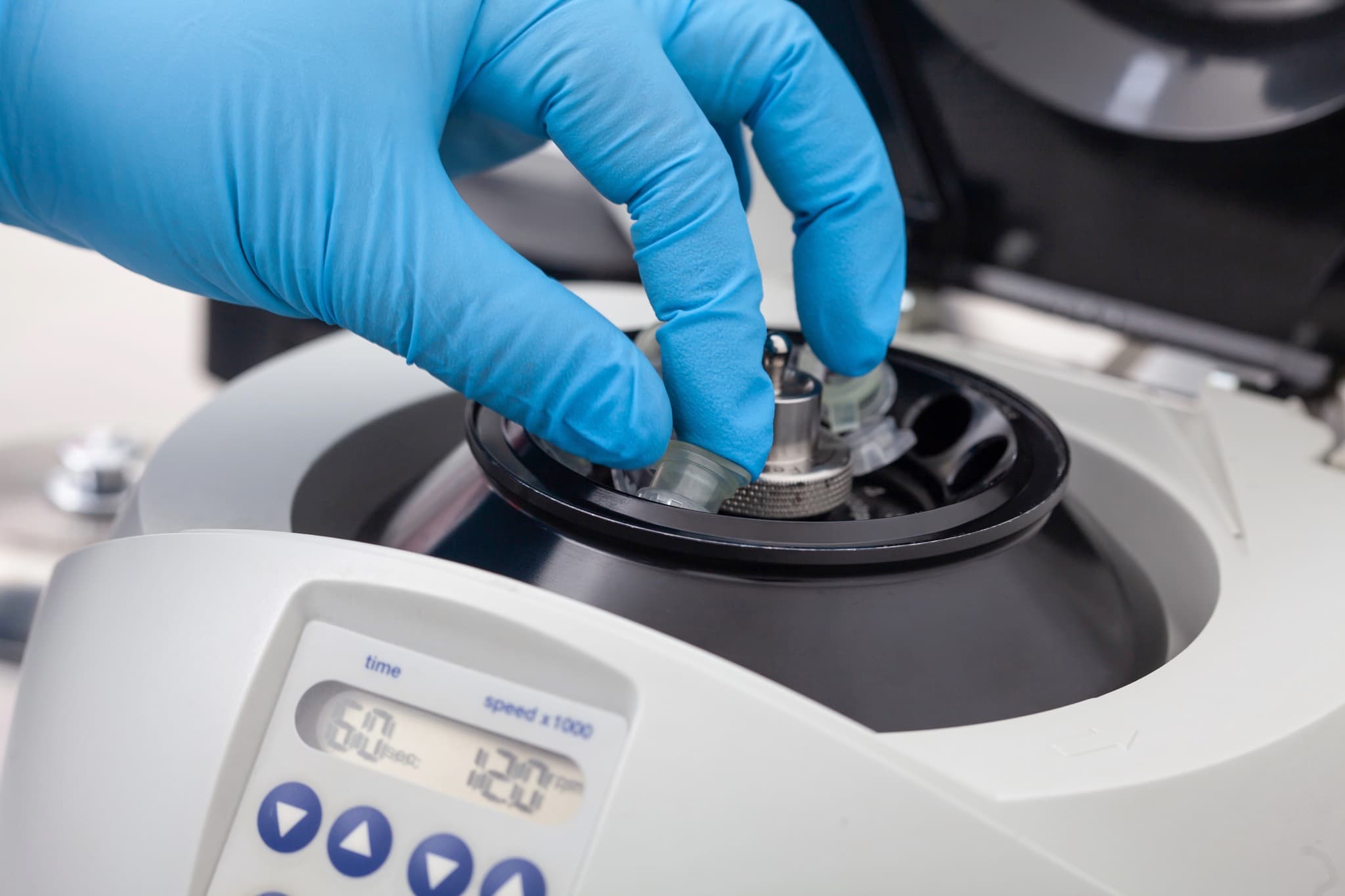 Gloved hand using centrifuge for Stem Cell / Medicinal Signaling Cell preparation